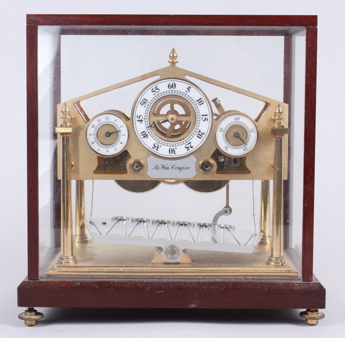 A limited edition Congreve rolling ball clock, by Devon Clocks, 316/500, in class case, 8 1/4" high