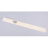 A Victorian ivory page turner with engraved monogram