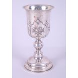 A Continental white metal goblet, decorated floral motifs