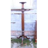 A late 19th century mahogany torchere stand, on turned and fluted column and tripod acanthus