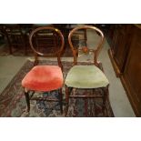 Two late 19th century loop back bedroom chairs, on turned and stretchered splay supports