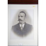 A 19th century style print of a gentleman with a moustache, in grained as rosewood frame, and a