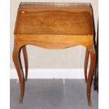 A mahogany inlaid bureau with brass gallery and fitted interior, on cabriole supports, 26"