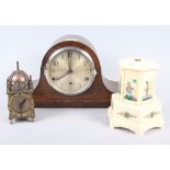 An oak cased mantel clock with Arabic numerals, a lantern clock with brass dial and Roman numerals