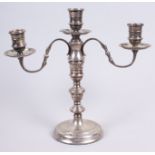 A silver three-light table candelabra of early 18th century design, on circular weighted base, 9.2oz