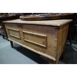 A late 18th century pine coffer with panelled front, on fishtail supports, 50" wide