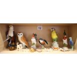 A Beswick barn owl, 7 1/2" high, a Beswick kingfisher, 4 1/2" high, a resin African fish eagle and a