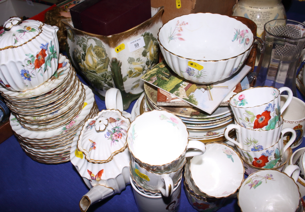 A musical jug, "The Eton Boating Song", 9 1/2" high, a Spode part teaset, collectors plates, a