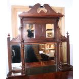 An Edwardian carved walnut overmantel, fitted five mirror plates and shelves, 36" wide