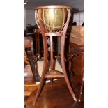 An Edwardian mahogany and inlaid jardiniere stand with brass basin, on splayed supports, 14" dia