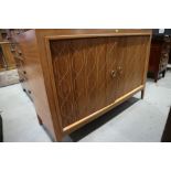 A Gordon Russell double helix teak and American black walnut two-door sideboard, on square taper