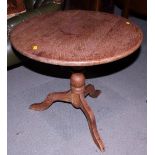 An oak circular topped occasional table, on turned column and tripod splay supports, 22" dia