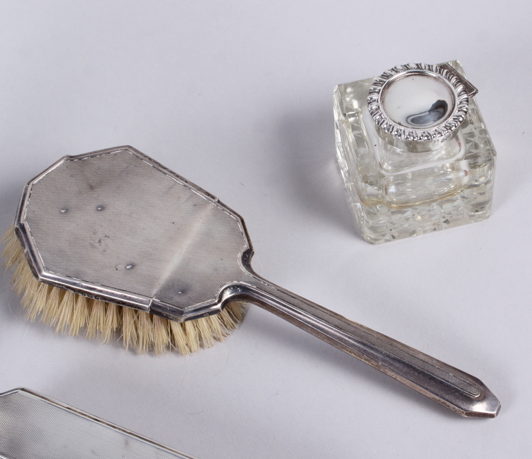 A pair of cylindrical silver candlesticks, two silver inkwells, a silver backed dressing table set - Image 5 of 5