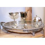 A silver plated gallery tray, two plated goblets and a glass preserve pot, in the form of an