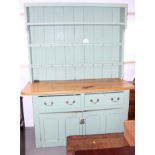 A 19th century green painted pine dresser, the upper section with open shelves over two drawers