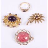 A 9ct gold and garnet cabochon ring, two 9ct gold amethyst and seed pearl brooches, and a