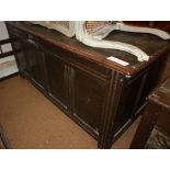 An 18th century oak four panel front coffer, on stile supports, 60" wide