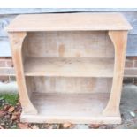 A waxed pine low open bookcase, on block base, 27" wide