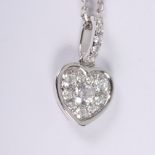 A white metal heart-shaped pendant set pave diamonds, stamped 18ct to loop, on 18ct white gold