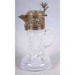 A cut glass and silver plate topped claret jug, decorated cherubs with lion finial, 11 1/2" high