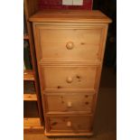 A pine chest of four drawers, on bun feet, 19 1/2 wide