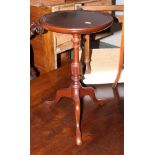 A polished as mahogany circular wine table, on turned column and tripod splay supports, 12" dia, and