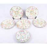Five 19th century Canton plates, decorated panels with figures, flowers and insects, 9 1/2" dia, and