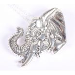 A white metal pendant, formed as the head of an elephant, stamped sterling, on white metal chain,