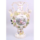 A two-handled vase, decorated fruit and flowers in high relief, with two painted panels of