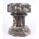 A 19th century fossil marble miniature font with four columns and central square pillar, on