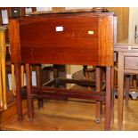 An Edwardian mahogany Sutherland table, on square taper supports, 25" wide