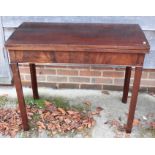 A George III mahogany fold-over top card table, on chamfered supports, 36" wide