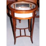 An Edwardian mahogany and inlaid circular bijouterie table, on square splayed stretchered