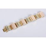 An Art Deco style yellow metal linked panel bracelet, stamped 585, 7 3/4" long (including clasp),