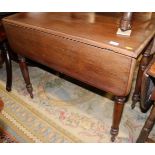 A 19th century mahogany Pembroke table, fitted single drawer, on turned supports, 35 1/2" wide