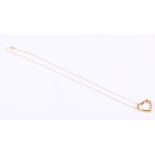 A 9ct gold heart-shaped pendant set single diamond, on yellow metal chain, stamped 375