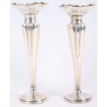 A pair of Edwardian silver bud vases, on weighted bases, 8" high