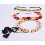 Three "Amber" necklaces, various