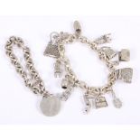 A silver Tiffany roundel charm on associated white metal charm bracelet, clasp stamped 925, and a