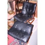 A 1970s Ingmar Relling design armchair, button upholstered in a black leather, and a matching