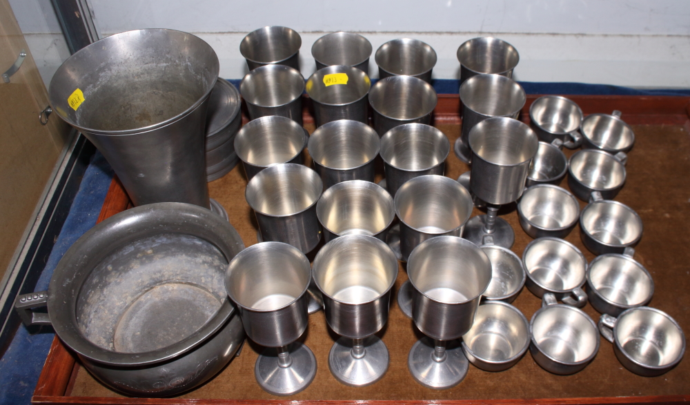 A set of eighteen pewter goblets, twelve punch cups, a vase, a bowl, and a bowl and cover