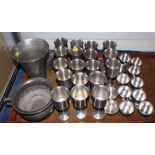 A set of eighteen pewter goblets, twelve punch cups, a vase, a bowl, and a bowl and cover