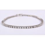 A diamond tennis bracelet, 3ct approx, in white metal mount, stamped 18ct