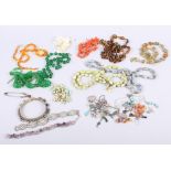 A coral twig necklace, a mother-of-pearl necklace, a collection of glass and other bead necklaces, a