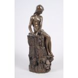 A Giovanni Schoeman resin figure of a seated lady on a wall, 5 1/2" high