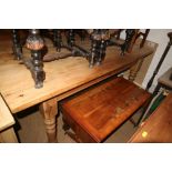 A yew and banded sofa type coffee table, on splay supports and a brass standard lamp