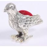 A white metal pin cushion, formed as a bird, 1 1/2 high