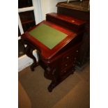 A polished as mahogany Davenport desk of 19th century design, fitted four drawers, on cabriole