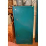 A green painted metal four-gun cabinet, fitted inner locking cupboard and shelves, with keys, 24"