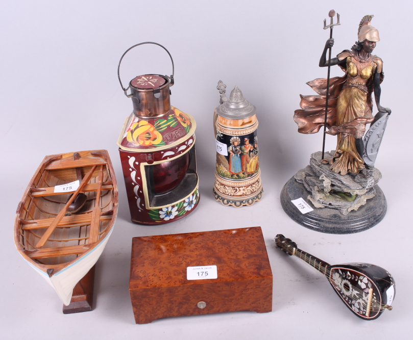 A figure of Britannia, on stand, 13" high, a model rowing boat, a musical box, a stein, a mandolin